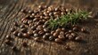 © Andi - Roasted coffee beans are clustered with a sprig of aromatic green herbs, resting on a rough-hewn wooden surface with visible grains and textures, showcasing natural elements in a macro photograph.