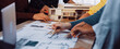 © InfiniteFlow - A vibrant scene depicting a diverse group of architects collaborating on a design project, using blueprints and a physical model during an engaging planning session. SACTR