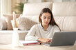 © PheelingsMedia - Concentrated student learning online at home