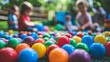 © bborriss - Vibrant children engaged in play with colorful balls, showcasing dynamic movement and joy