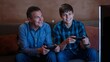 © Future Vision - Playing father and teenage son sitting on sofa in living room, with TV screen and controllers