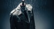 © AFFANYUDA - Mannequin bust wears a trench coat in simulated rain, dark setting