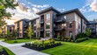 © Stefan Schurr - Modern multifamily housing property with brick, siding facade features balconies, manicured lawns