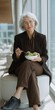 © Andrii Zastrozhnov - Elderly caucasian female enjoying healthy salad in modern urban setting