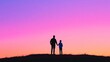 © Cosmic Edge - Silhouette of a parent and child enjoying a colorful sunset on a hilltop during evening hours