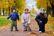 © justoomm - Children enjoy autumn in the park