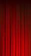 © octopusaga - Closed  Red Curtain Cinema Theater Vertical Background Vector Illustration