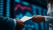 © Bussakon - Two people exchanging a document in front of a blurred financial data display