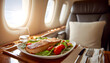 © wolfelarry - Gourmet meal served on tray in first class airplane seat. Enjoy fine dining experience with delicious food and scenic flight view