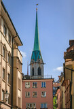 Historic Old Town street with Predigerkirche church spire in Zurich, Switzerland