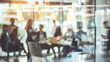 © narumon - Blurred image of meeting in modern office with group of business people sitting around table, concept for corporate background.