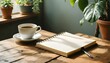© Zahro - ultra-realistic 4K image of a plain notebook on a wooden table with a cup of coffee and green plant nearby, cozy atmosphere, blank front cover for branding or design mockup