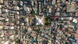 © irawan - Aerial view captures dense urban development surrounding a central domed religious structure