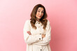 © luismolinero - Middle aged caucasian woman isolated on pink background making doubts gesture while lifting the shoulders