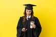 © luismolinero - Middle aged university graduate isolated on yellow background holding coffee to take away and a mobile