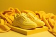 © zenith - Yellow sneakers on fabric surface with monochrome background