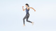 © metamorworks - Full-body photo of a woman in sportswear jumping. (We also sell PNGs that are cropped and have transparent background. Please search for 'PNG' from the creator link.)