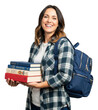 © Alloca Design Studio - A smiling woman holding a stack of books while wearing a plaid shirt, against transparent background