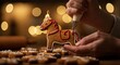 © Sergiy - A person's hands meticulously decorate a festive gingerbread Dala horse cookie with white and red icing, featuring a small flame, against a warm bokeh background.