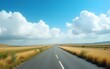 © Jesse - Road, landscape and field with environment in countryside for travel, roadtrip and adventure with blue sky. Clouds, nature and street for holiday journey, destination and tourism with outdoor scenery