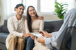 © Pormezz - Spouses relationship consultant concept, Married couple listen to psychologist  during therapy talk session for married couple that mental health breakdown and relationship problems.