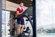 © bongkarn - Asian middle aged strong healthy man with a towel on shoulder running exercising on treadmill in gym