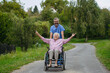 © Halfpoint - Male home nurse pushing elderly woman in wheelchair, having fun.