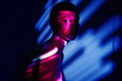 © VISTA by Westend61 - Surreal portrait with neon magenta and blue light effects