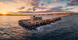 Aerial view of lighthouse at sunset in Varna city, Bulgaria, sunrise seascape panorama