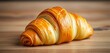 © Pimchada - Single, perfectly baked croissant, golden brown, flaky layers,  breakfast,  shop