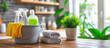 © Taras Vykhopen - Cleaning tools and supplies organized on a wooden table in a bright kitchen setting