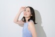 © Yamatatsu - 日差しを浴びる日本人女性のビューティイメージ