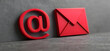 © sornram - Red '@' symbol and envelope on a gray background represent digital communication and email connectivity.
