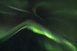 © Travel 'n' Lifestyle - View of spectral green aurora borealis dances across the inky Icelandic sky, a celestial ballet of light and shadow, Reykjavík, Aurora Borealis, Iceland.