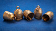 © MarekPhotoDesign.com - Handmade vintage indian tin bells on blue art paper