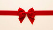 © Pro Graphics Store - Vibrant red satin bow tied on a broad ribbon ready for gift wrapping elegance