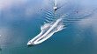 © AmazingAerialAgency - Aerial view of boats sailing across the tranquil waters, leaving trails of white foam in their wake, Oslo, Norway.