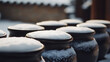 © A2Z AI  - Winter's touch: Ceramic jars topped with pristine snow. A serene landscape where cold meets craftsmanship, capturing a moment of quiet beauty in nature's embrace.