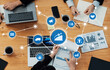 © InfiniteFlow - A team engages in a productive business meeting, utilizing technology and visuals to discuss marketing strategies and analyze growth metrics in a collaborative environment. Amity