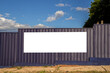 © AlfRibeiro - Blank banner for advertisement on the metal fence of construction site in Brazil
