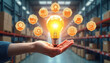 © Pete - Hand holds glowing lightbulb over warehouse shelves filled with boxes. Icons show logistics, delivery, planning, ideas. Innovative supply chain solution concept.