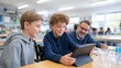 © Alex - Engaging Classroom Learning Experience with Technology: Children Collaborating on Digital Devices with Supportive Teacher Guidance