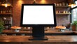 © Viktor - Point of sale system with blank white screen on wooden restaurant counter. POS terminal as cash register at checkout desk in pizzeria cafe. Mockup display for payment system, digital menu, food