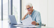 © peopleimages.com - Laptop, thinking and old man with documents, financial analysis and bills with retirement fund. Pc, home and senior person with paperwork, debt and asset management with insurance policy and decision