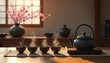 © Viktor - Image presents traditional Japanese tea ceremony. Tea cups and teapot on wooden table with steam. Cherry blossom in vase create peaceful atmosphere for tea time.