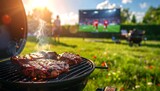 Juicy steaks grilling on barbecue with soccer match on screen in sunny garden