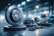 © whitestorm - Close-up of car brake discs and brake pads on a workshop table, showcasing high-quality replacement parts and components for automotive maintenance and repair.