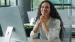 © Yuliia - Pretty hispanic business woman work with computer smiling in office looking at camera happy confident businesswoman ethnic female worker girl entrepreneur posing at table in company workplace smile