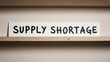 © Stas - SUPPLY SHORTAGE sign on wooden surface symbolizing collapse of distribution systems