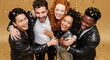 © Milan - A diverse group of happy friends celebrating at a party. Young multiethnic people laughing together under falling gold confetti